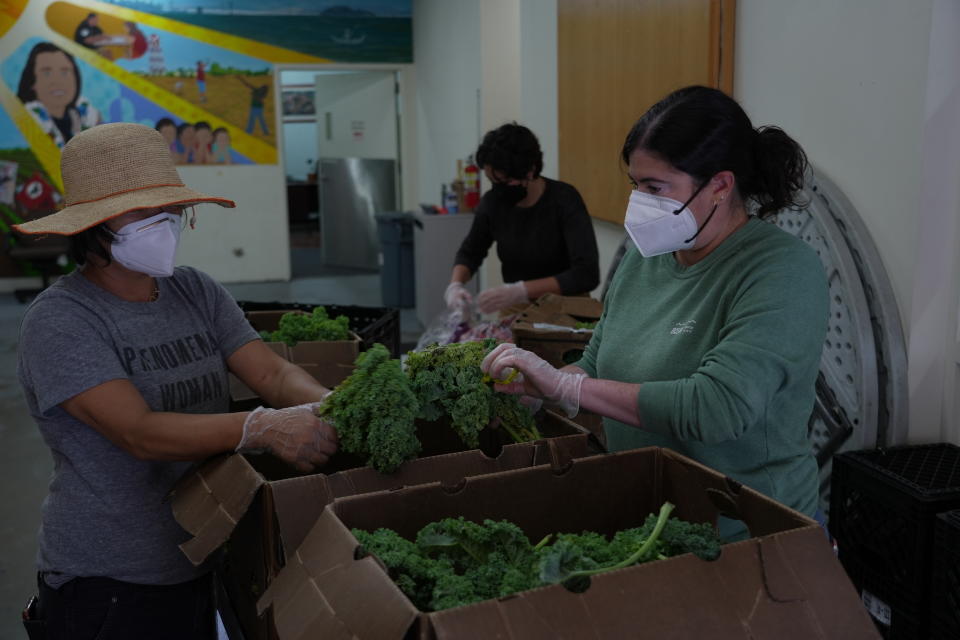 From left, Polly Sang, Patty Apple and Jen Franco, sort and clean vegetables for donation at Food Shift, a nonprofit organization that collects unwanted groceries and distributes them to the needy on Tuesday, Sept. 13, 2022, in Alameda, Calif. "Best before” labels are coming under scrutiny as concerns about food waste grow around the world. Manufacturers have used the labels for decades to estimate peak freshness. But “best before” labels have nothing to do with safety, and some worry they encourage consumers to throw away food that’s perfectly fine to eat. (AP Photo/Terry Chea)