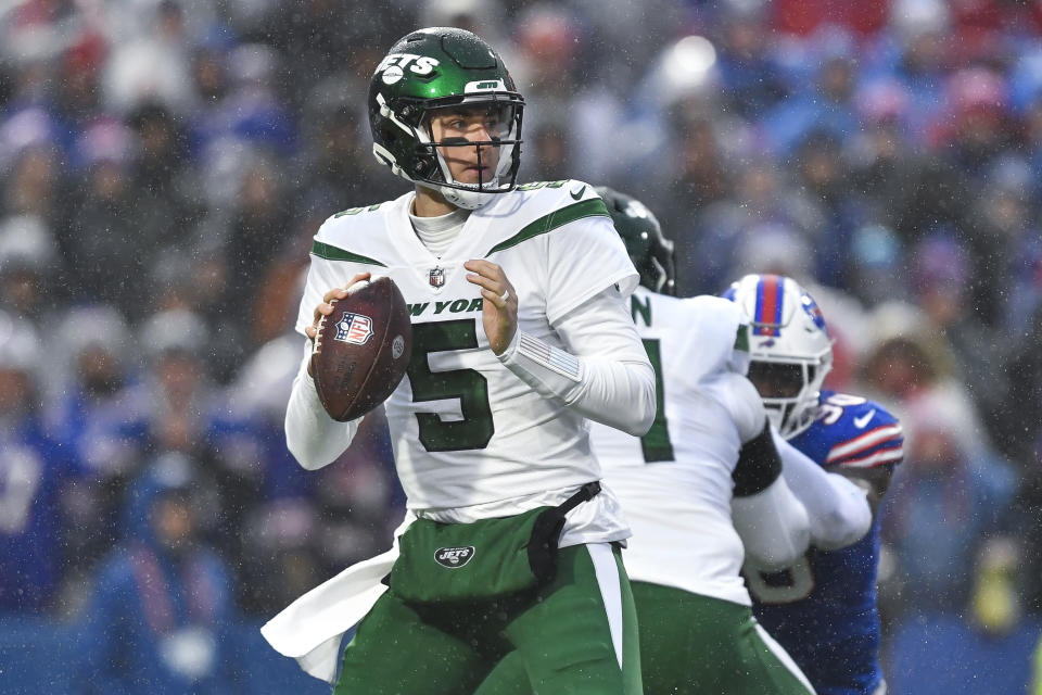 New York Jets quarterback Mike White (5) looks to pass during the first half of an NFL football game against the Buffalo Bills in Orchard Park, N.Y., Sunday, Dec. 11, 2022. (AP Photo/Adrian Kraus)