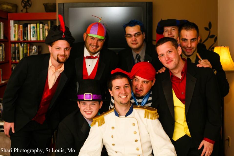 <div class="caption-credit"> Photo by: Shari Photography</div>The groomsmen as classic Disney villains: L-R: Jafar (from Aladin), Tweedle Dee (Alice in Wonderland), Hades (Hercules), Frollo (The Hunchback of Notre Dame), Scar (The Lion King). Second row: Governor Ratcliffe (Pocahontas), Mr. Smee (Captain Hook), Gaston (Beauty and the Beast), and the groom Prince Eric.