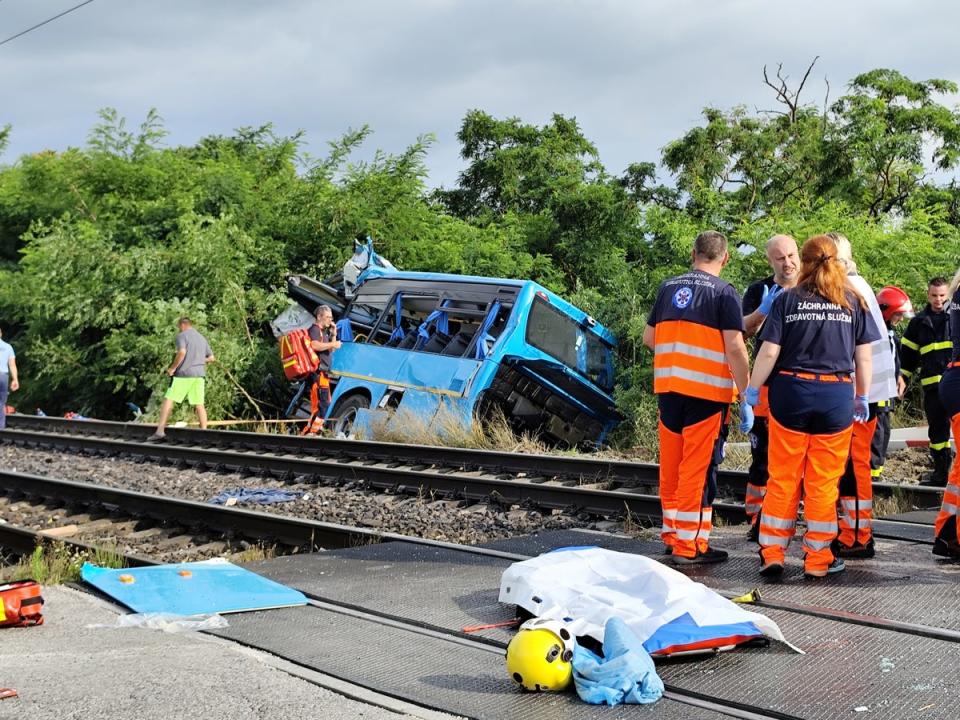 Emergency personnel work at the site of the crash (via REUTERS)