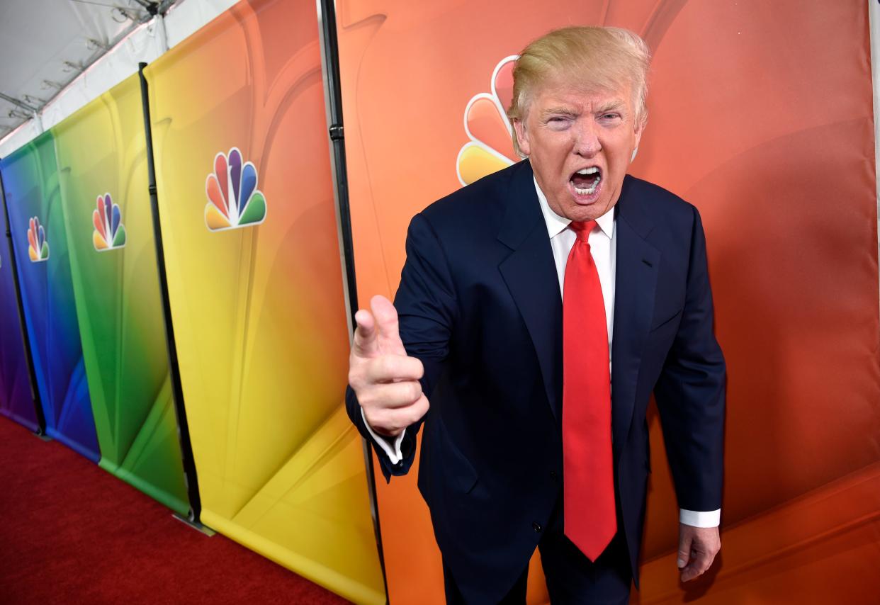 In this Jan. 16, 2015 file photo, Donald Trump, then-host of the television series "The Celebrity Apprentice," mugs for photographers in Pasadena, Calif.