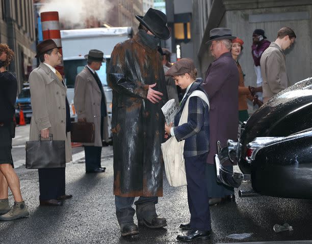 <p>Jose Perez/Bauer-Griffin/GC Images</p> Christian Bale and his son on the set of 'The Bride'