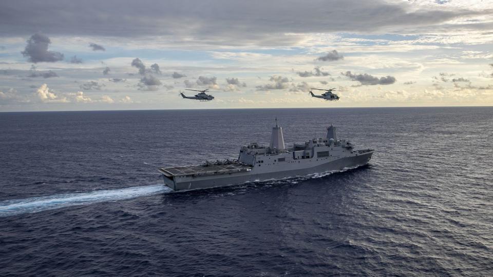 Pilots with the 13th Marine Expeditionary Unit fly over the amphibious transport dock Anchorage on Dec. 8, 2022. (Sgt. Brendan Custer/U.S. Marine Corps)