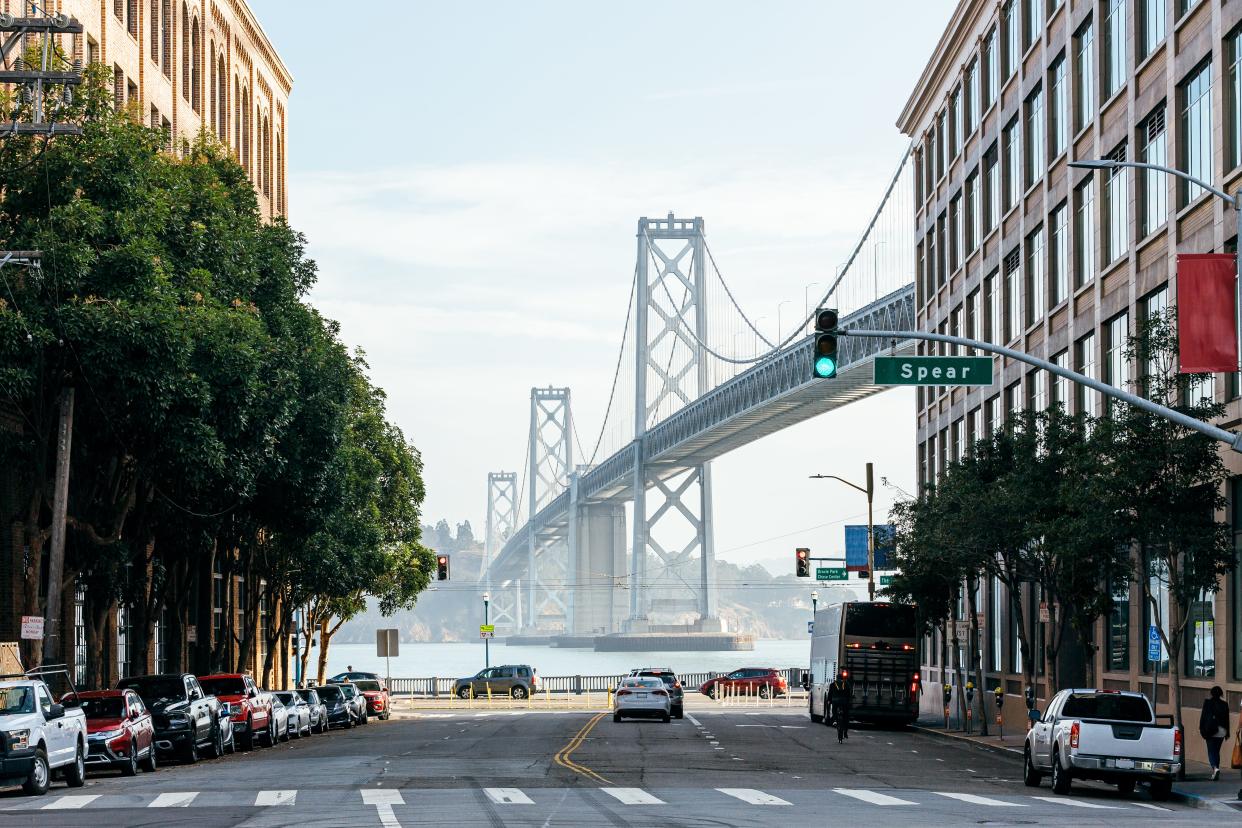 The San Francisco - Oakland Bay Bridge and street in San Francisco, California, USA