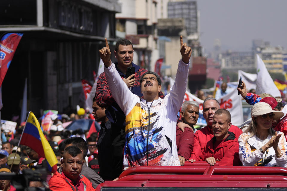 FILE - Venezuelan President Nicolas Maduro points upwards as he is driven to the electoral council headquarters to register his candidacy for a third term, in Caracas, Venezuela, March 25, 2024. Maduro has so far managed to block his chief opponents from running in the upcoming July 28th presidential election.(AP Photo/Matias Delacroix, File)