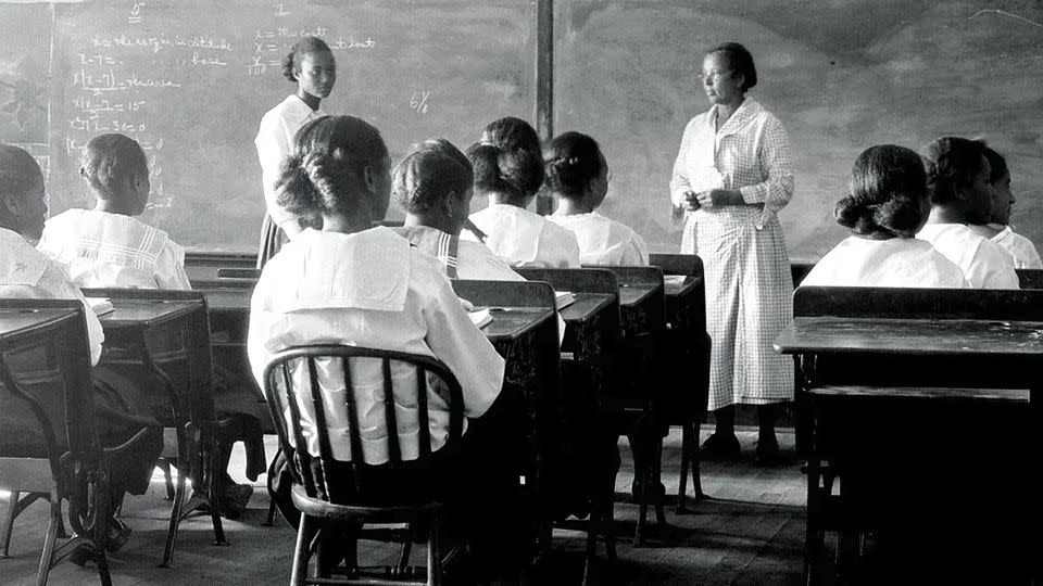 A historic photo of students at a Rosenwald School. The schools educated generations of Black Americans, including prominent graduates like the late John Lewis and poet Maya Angelou. - National Trust for Historic Preservation