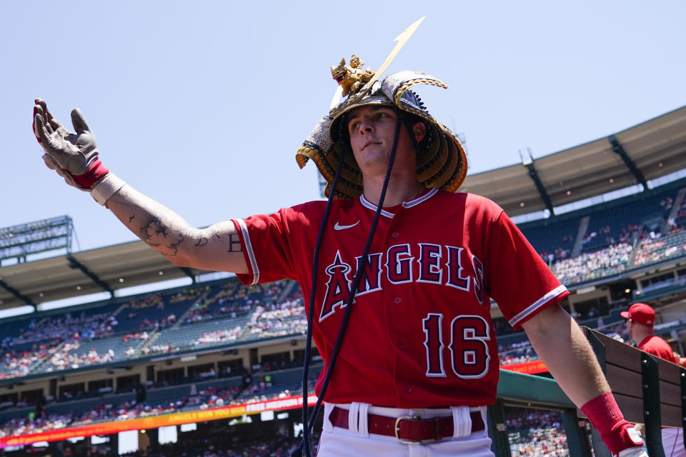 Los Angeles Angels' Mickey Moniak (16) celebrates in the dugout after hitting a home run during the first inning of a baseball game against the Chicago White Sox in Anaheim, Calif., Thursday, June 29, 2023. (AP Photo/Ashley Landis)