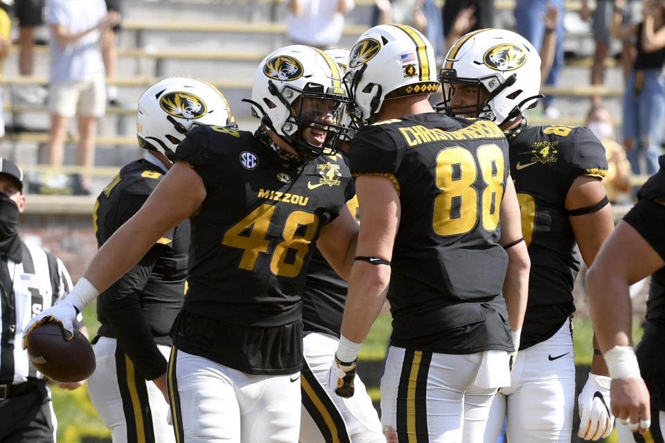 Missouri tight end Niko Hea (48) celebrates with teammate Logan Christopherson (88) after scoring during the second half of an NCAA college football game against LSU Saturday, Oct. 10, 2020, in Columbia, Mo. Missouri upset LSU 45-41. (AP Photo/L.G. Patterson)