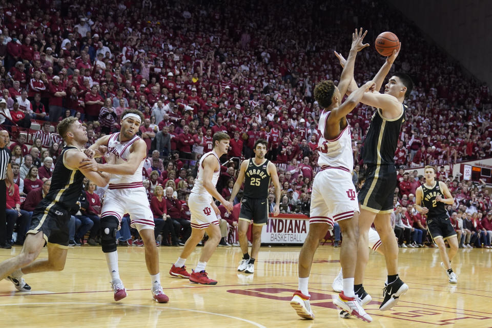 Purdue's Zach Edey (15) shoots over Indiana's Trayce Jackson-Davis (23) during the first half of an NCAA college basketball game, Saturday, Feb. 4, 2023, in Bloomington, Ind. (AP Photo/Darron Cummings)