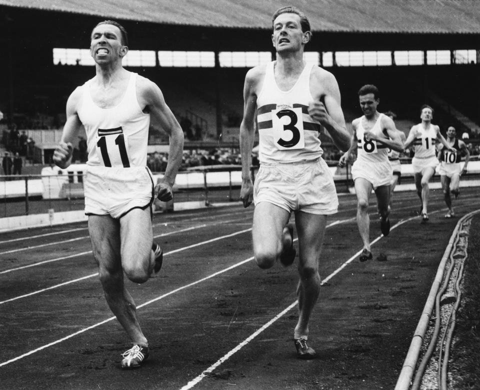Hewson, right, takes on his Belgian rival Roger Moens in the mile at White City in 1956 - Ed Lacey/Popperfoto