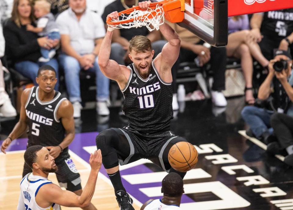 Sacramento Kings center Domantas Sabonis (10) dunks the ball against the Golden State Warriors during the first half of Game 1 of the first-round NBA basketball playoff series at Golden 1 Center on Saturday, April 15, 2023.