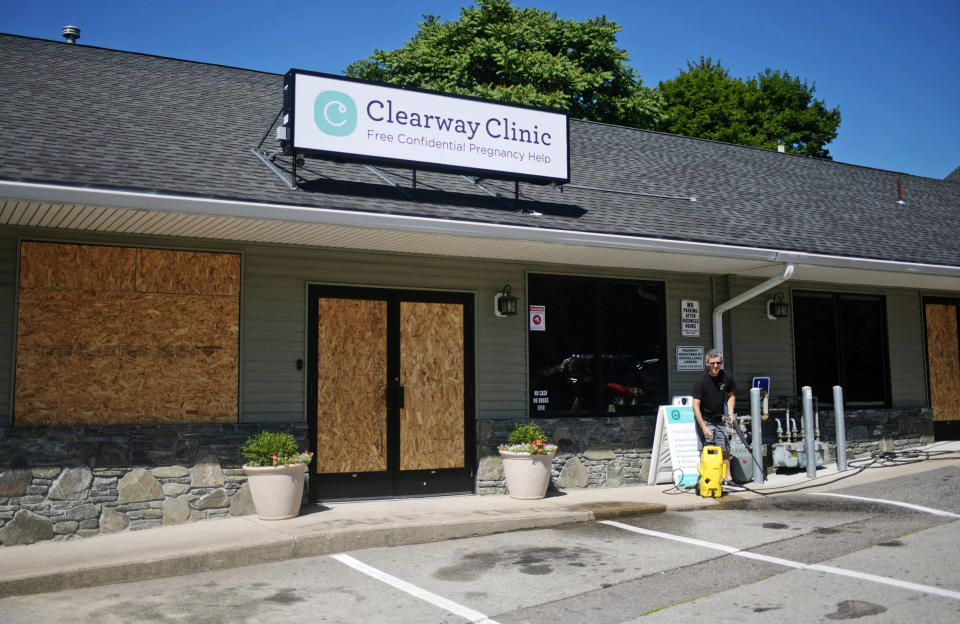 Windows are boarded up at Clearway Clinic, where vandals smashed windows with a hammer on July 7, 2022. (Christine Peterson / Telegram & Gazette / USA Today Network)
