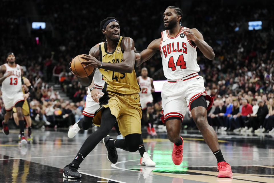 Toronto Raptors' Pascal Siakam (43) drives past Chicago Bulls' Patrick Williams (44) during the second half of an NBA basketball In-Season Tournament game Friday, Nov. 24, 2023, in Toronto. (Frank Gunn/The Canadian Press via AP)