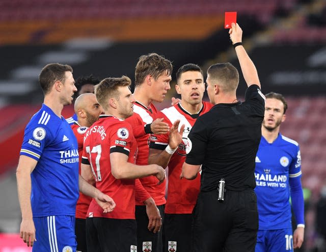 Jannik Vestergaard (centre) is sent off