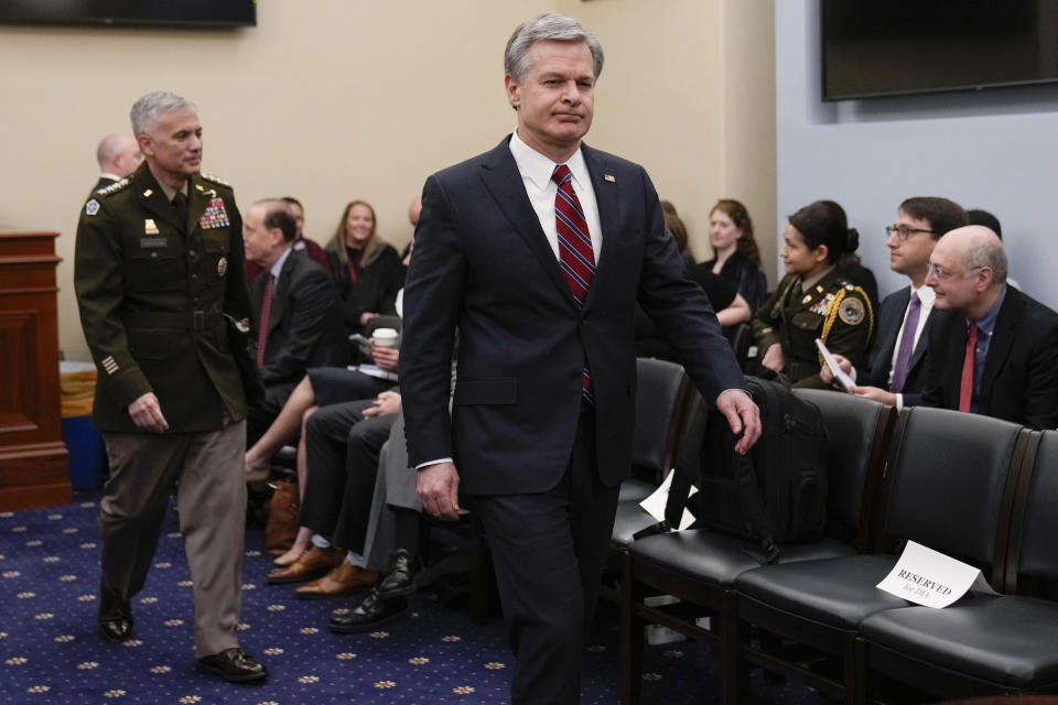 FBI Director Christopher Wray, followed by Commander, U.S. Cyber Command and Director, National Security Agency/Chief, Central Security Service Gen. Paul Nakasone arrives for the House Select Committee on Intelligence annual open hearing on worldwide threats at the Capitol in Washington, Thursday, March 9, 2023. (AP Photo/Carolyn Kaster)