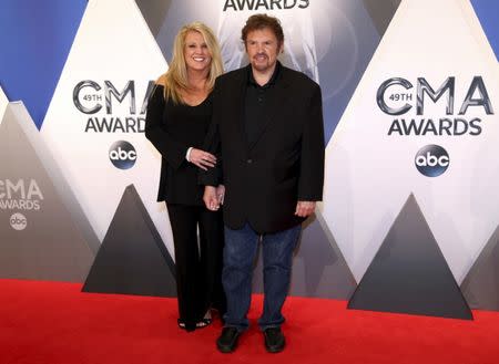 Musician Jeff Cook and his wife Lisa arrive at the 49th Annual Country Music Association Awards in Nashville, Tennessee November 4, 2015. REUTERS/Jamie Gilliam