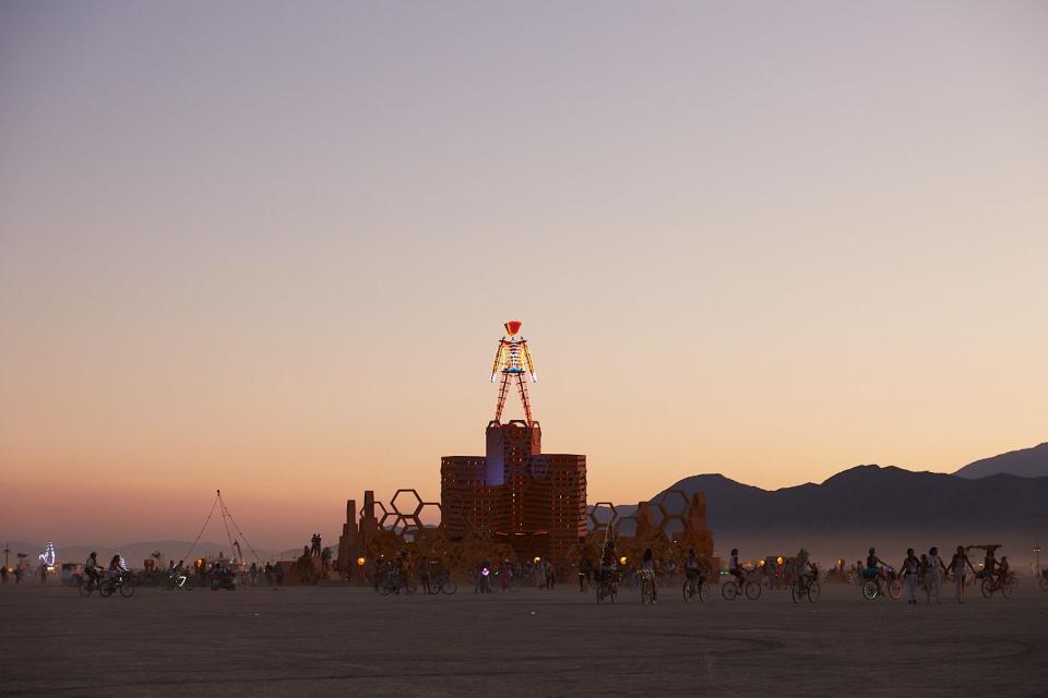 The Man at sunset during Ari and Chase Burning Man wedding