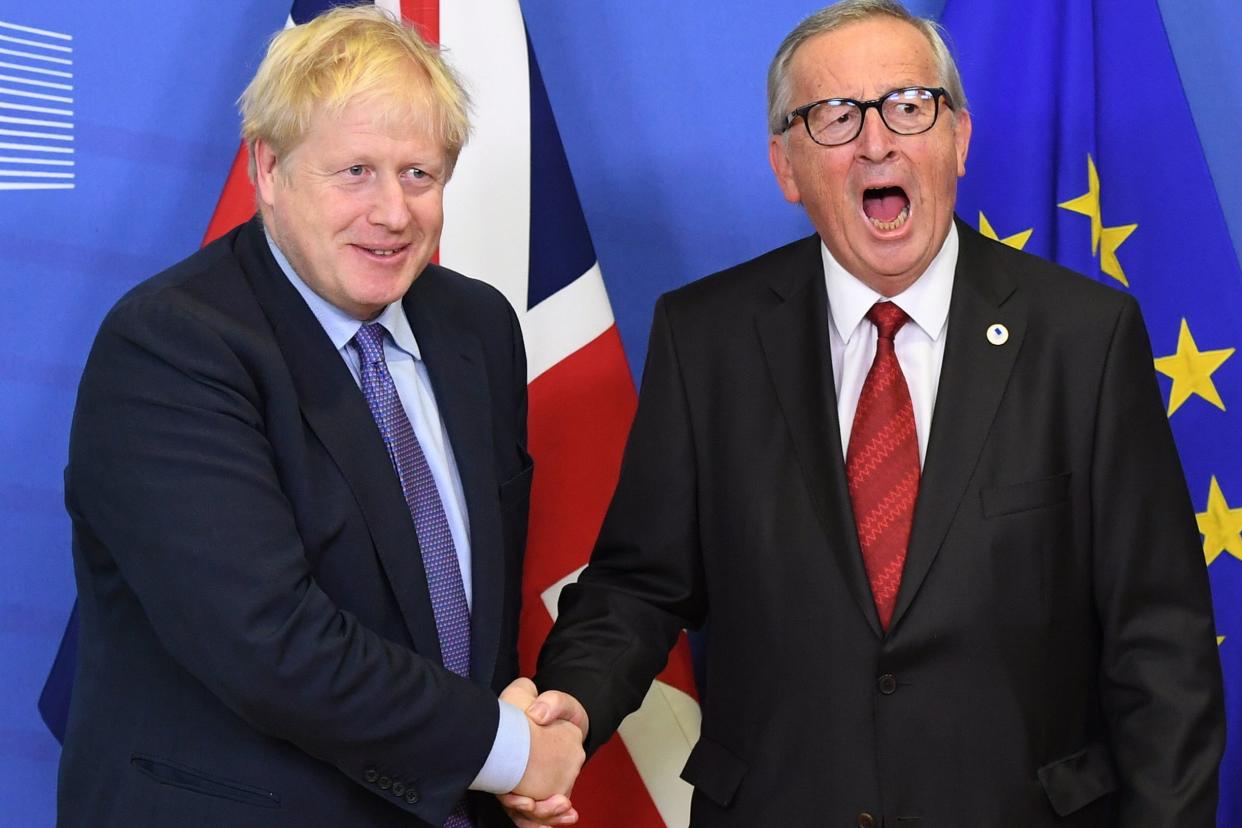 <p>Boris Johnson and Jean-Claude Juncker, President of the European Commission, ahead of the opening sessions of the European Council summit at EU headquarters in Brussels in 2019</p> (PA)