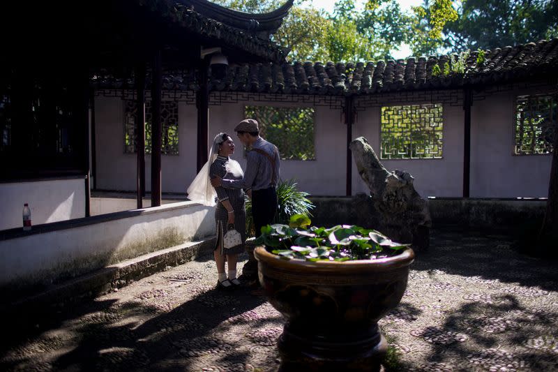 The Wider Image: Coronavirus dampens celebrations in China's wedding gown city