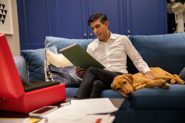 Chancellor Rishi Sunak, kept company by his red Labrador retriever puppy Nova, works on his budget speech in his flat in Downing Street (Photo: SIMON WALKER  HM TREASURY)