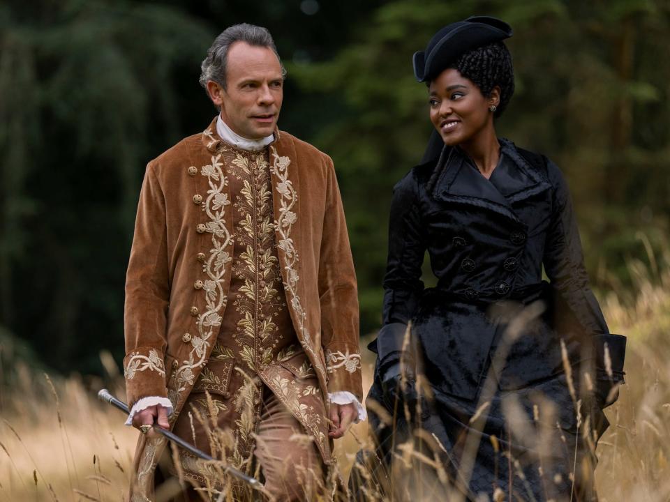 Lord Ledger (Keir Charles) and Young Agatha Danbury (Arsema Thomas) on a walk.