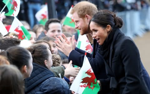 Prince Harry and Meghan Markle meet Cardiff school children - Credit: Chris Jackson/Getty