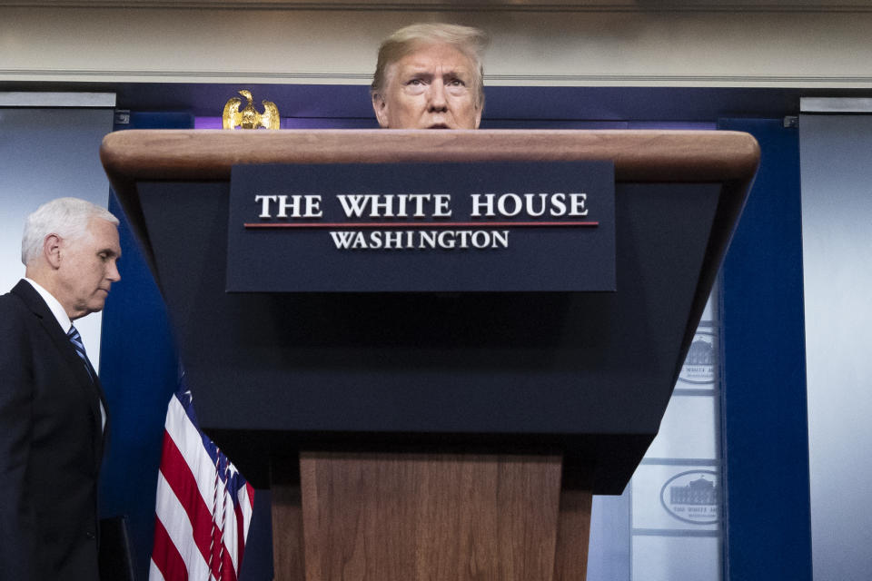 President Donald Trump speaks about the coronavirus, with Vice President Mike Pence nearby, in the James Brady Press Briefing Room of the White House, Friday, April 24, 2020, in Washington. (AP Photo/Alex Brandon)