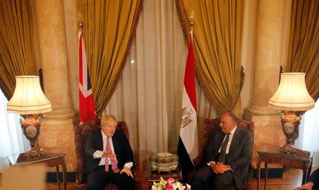 Egyptian foreign minister Sameh Shoukry (R) meets with British Foreign Secretary Boris Johnson at Tahrir Palace in Cairo, Egypt February 25, 2017. REUTERS/Amr Abdallah Dalsh