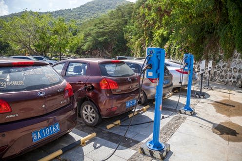 <span class="caption">Electric cars charging on Hainan Island, China.</span> <span class="attribution"><a class="link " href="https://www.shutterstock.com/image-photo/china-hainan-island-sanya-bay-december-1263272644?src=qCOg7JUM64YaMc5dascptg-1-0" rel="nofollow noopener" target="_blank" data-ylk="slk:Evgenii mitroshin/Shutterstock;elm:context_link;itc:0;sec:content-canvas">Evgenii mitroshin/Shutterstock</a></span>