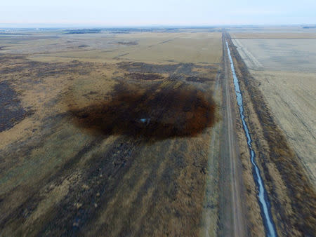 FILE PHOTO: An aerial view shows the darkened ground of an oil spill which shut down the Keystone pipeline between Canada and the United States, located in an agricultural area near Amherst, South Dakota, U.S., in this photo provided November 18, 2017. REUTERS/Dronebase/File Photo MANDATORY CREDIT.