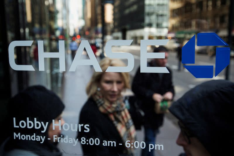 FILE PHOTO: A customer walks out of a branch of the JPMorgan Chase & Co bank in New York