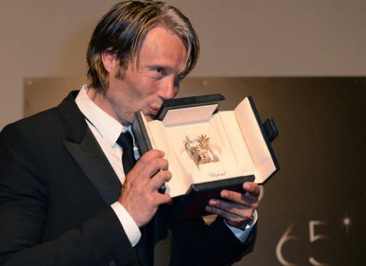 Danish heart-throb Mads Mikkelsen, pictured here, clinched the best actor prize at Cannes on Sunday for his role in Thomas Vinterberg's taut psychological thriller "The Hunt". Italian jury head Nanni Moretti and his eight-strong panel handed the prestigious award to Mikkelsen for his turn as a man who watches his life unravel after he is falsely accused of molesting a child