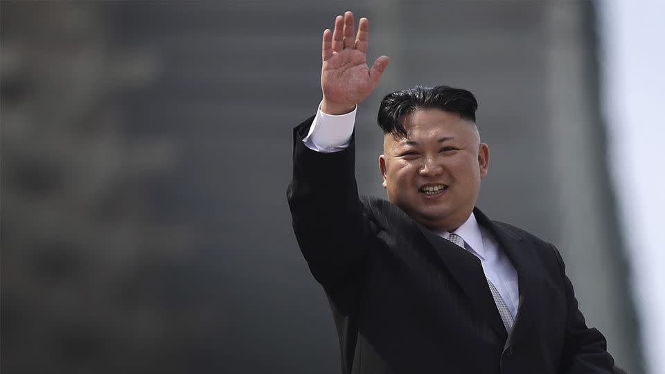 North Korean leader Kim Jong-un waves during a military parade for the celebration. Source: AP