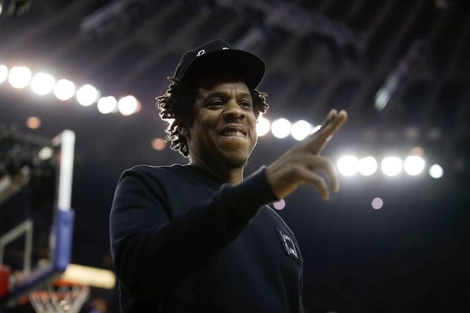 Jay-Z gestures while walking to his seat during the first half of Game 3 of basketball’s NBA Finals between the Golden State Warriors and the Toronto Raptors in Oakland, Calif., Wednesday, June 5, 2019. (AP Photo/Ben Margot)