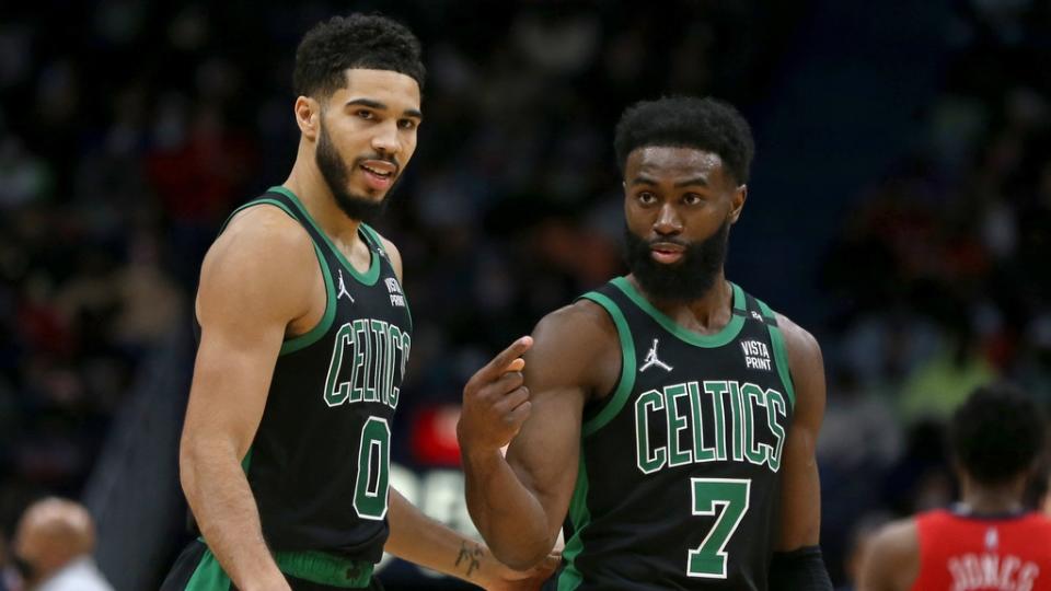 Jan 29, 2022; New Orleans, Louisiana, USA; Boston Celtics forward Jayson Tatum (0) talks to guard Jaylen Brown (7) in the second half against the New Orleans Pelicans at the Smoothie King Center. Mandatory Credit: Chuck Cook-USA TODAY Sports