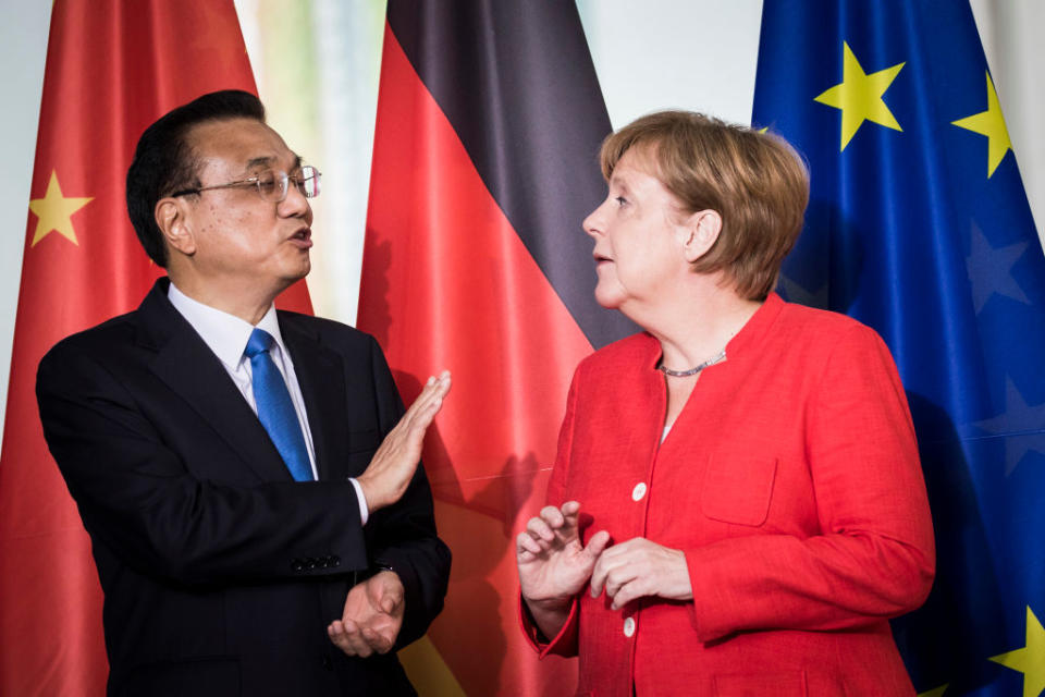 <p>German Chancellor Angela Merkel (R) and Li Keqiang, Prime Minister of China (L) are pictured in Berlin, Germany. The two governments are holding consultations that will include discussions on economic cooperation and trade. (Florian Gaertner/Photothek via Getty Images) </p>
