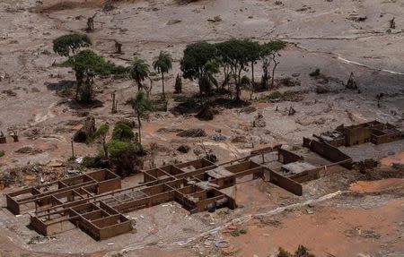 The debris of the municipal school of Bento Rodrigues district, which was covered with mud after a dam owned by Vale SA and BHP Billiton Ltd burst, is pictured in Mariana, Brazil, November 10, 2015. REUTERS/Ricardo Moraes/Files