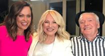 Kerri-Anne Kennerley poses with reporter Angela Cox and husband John.