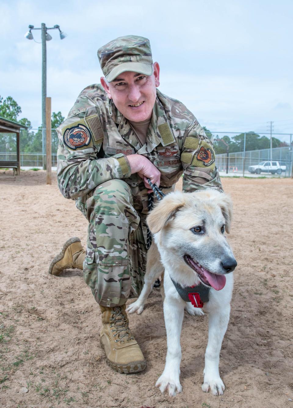 Air Force Senior Master Sgt. Chris Grimes is reunited with his dog Tucker at Navarre Central Bark in Navarre, Florida on Thursday, Feb. 16, 2023.