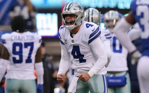 Dallas Cowboys quarterback Dak Prescott (4) reacts after a touchdown against the New York Giants during the third quarter at MetLife Stadium - Credit: USA TODAY