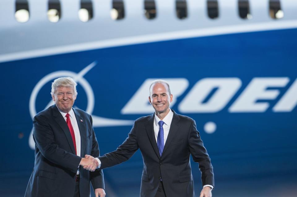 U.S. President Donald Trump, left, is introduced by Boeing's chief executive officer Dennis Muilenburg during the debut event for the Dreamliner 787-10 at Boeing's South Carolina facilities on February 17, 2017 in North Charleston, South Carolina. (Photo: Sean Rayford/Getty Images)