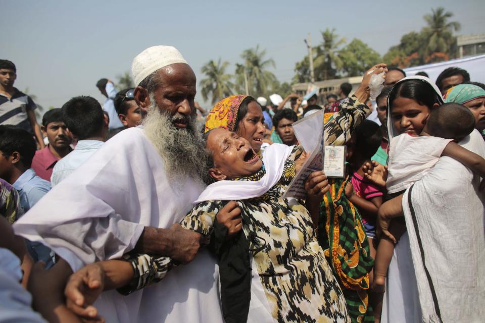 Relatives of victims killed in the collapse of Rana Plaza mourn on the first year anniversary of the accident, as they gather in Savar April 24, 2014. Protesters and family members of victims demand compensation on the one year anniversary of the collapse of Rana Plaza, in which more than 1,100 factory workers were killed and 2,500 others were injured.