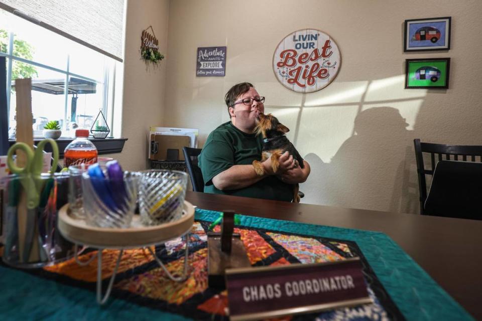 Park Manager Joy Anderson works from her office with her dog Rocco helping residents with anything they may need at Gallagher Acres RV Park in Fort Worth on Wednesday, August 23, 2023.