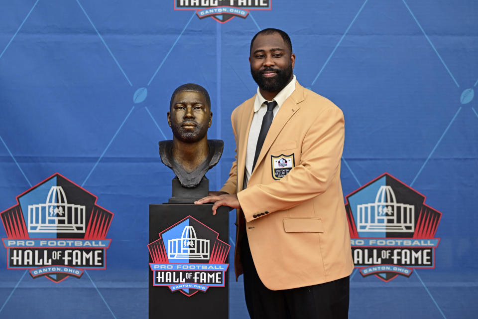 Former NFL player Darrelle Revis poses with his bust during his induction into the Pro Football Hall of Fame in Canton, Ohio, Saturday, Aug. 5, 2023. (AP Photo/David Dermer)