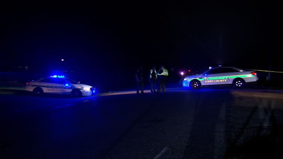 Law enforcement officers in Lake County, Florida, respond to the scene of a shooting that left a deputy dead on Friday night. - WFTV