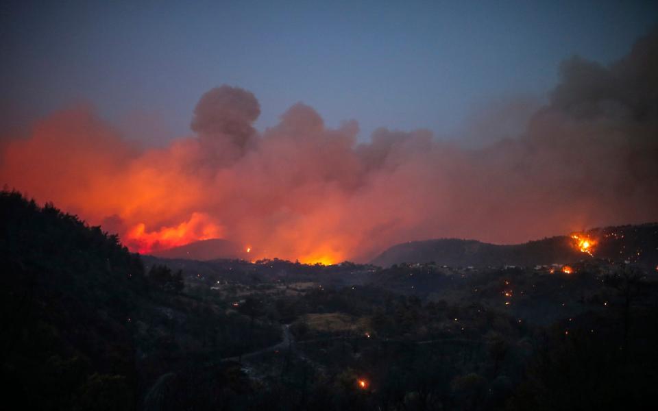 Fire engulfs the sky around the village of Cokertme, in Bodrum, late on Sunday night - Emre Tazegul/AP