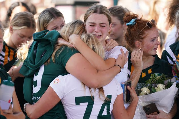 Members of the public take part in a vigil at the University of Nottingham after three people were killed and another three hurt in connected attacks on Tuesday morning.