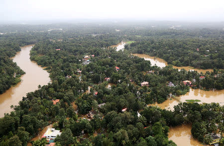 An aerial view shows partially submerged houses at a flooded area in Kerala, August 17, 2018. REUTERS/Sivaram V