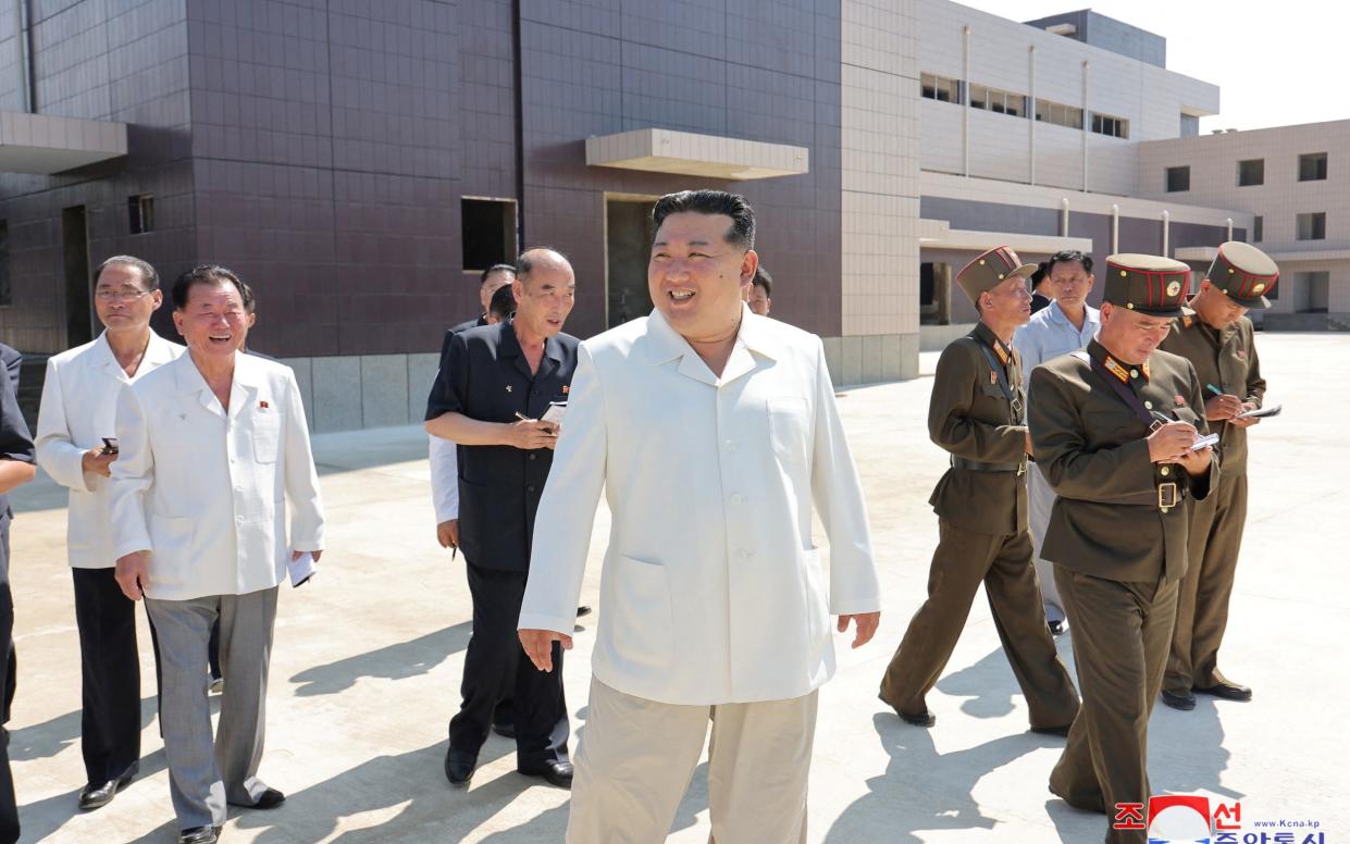 Kim Jong-un pictured during a visit to construction sites at various North Korean industrial factories