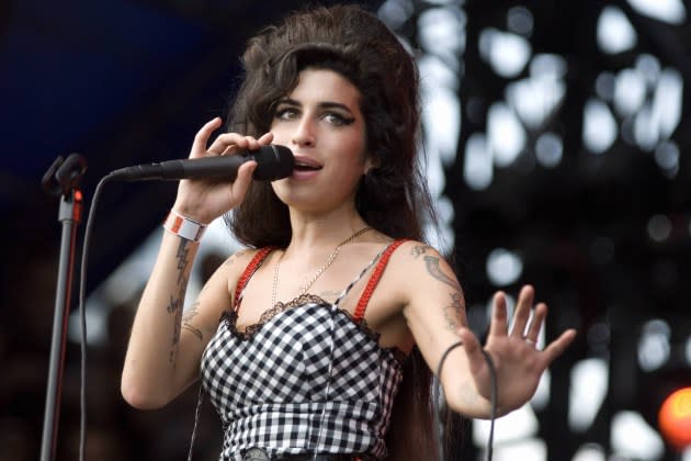 Winehouse performing onstage at Lollapalooza. A new movie and album reissue are sparking renewed interest in the late singer. - Credit: Daniel Boczarski/Redferns/Getty Images